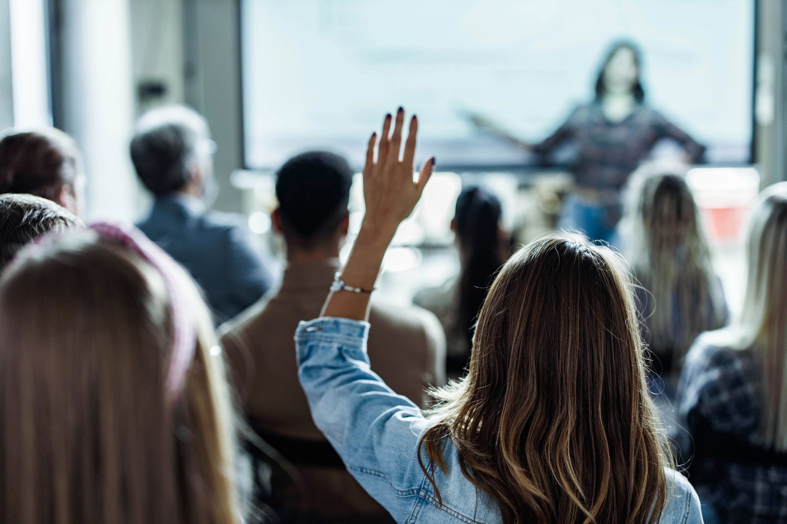 Person speaking at a community meeting