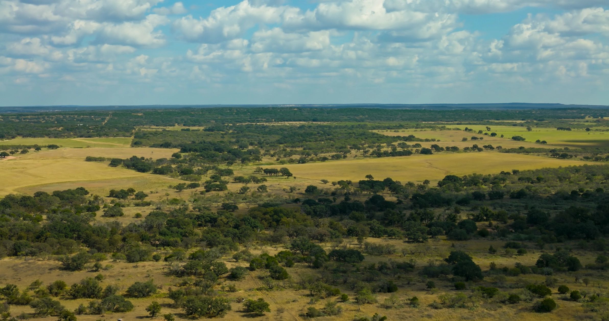 Aerial view of rural farmland and rolling hills